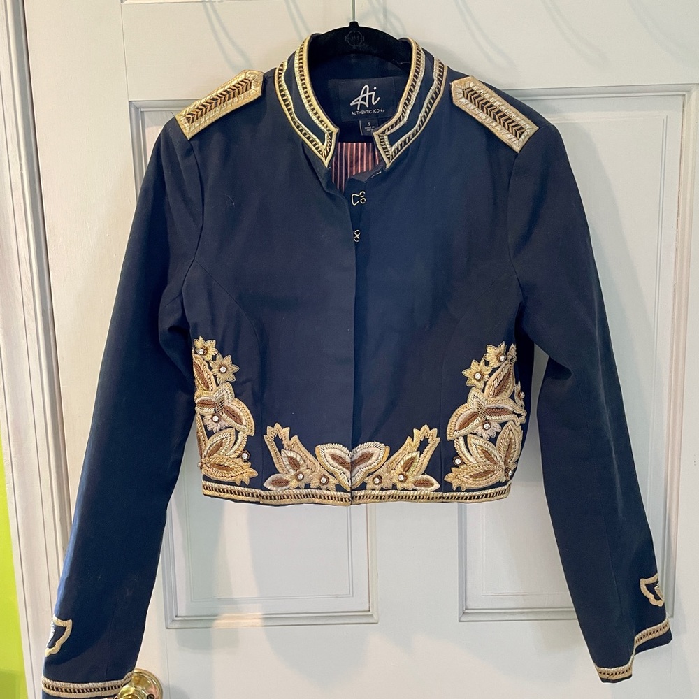 Navy blue military jacket with metallic embroidery and stones.